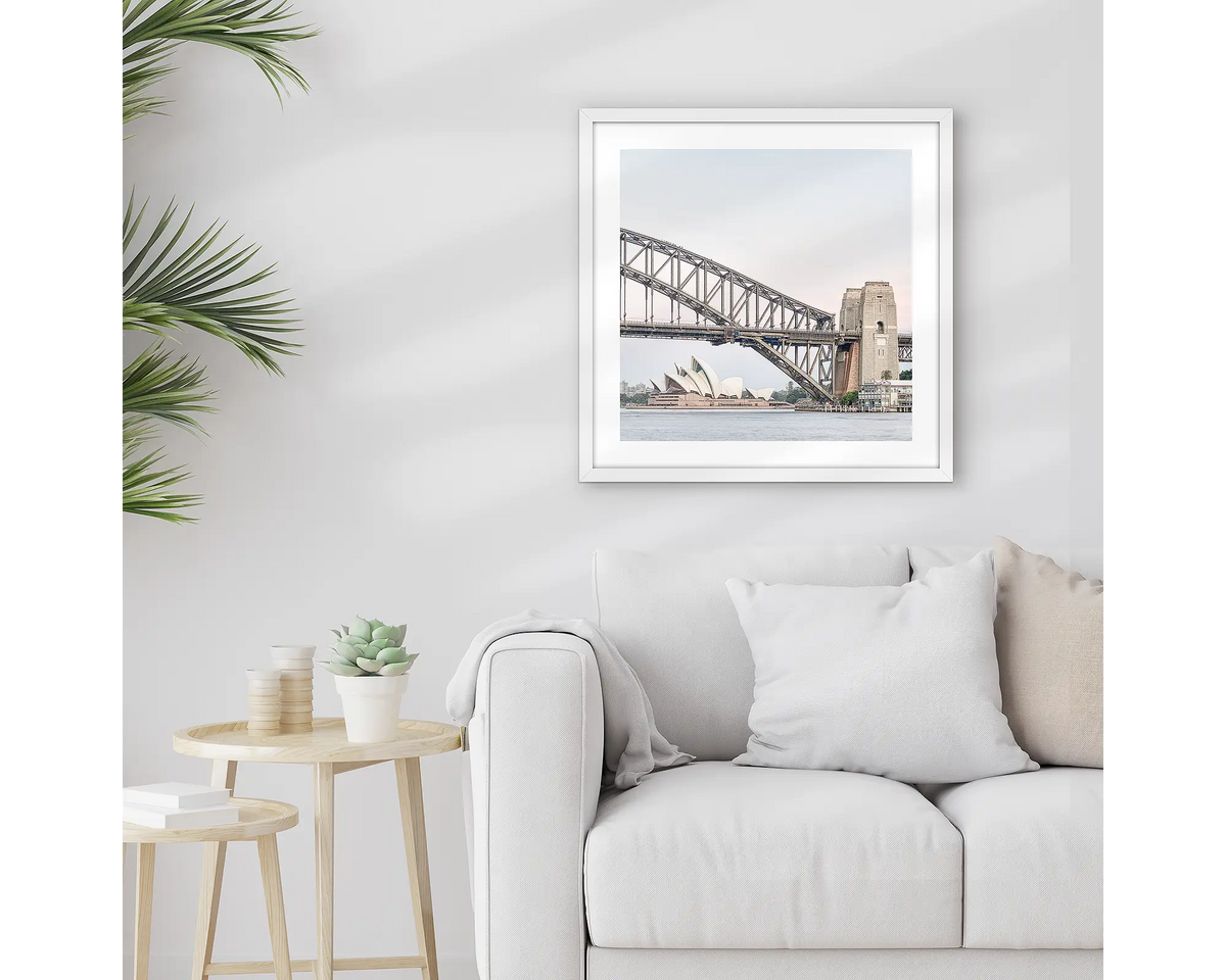 Sydney Icons. Sydney wall art print, with a white frame, hung above a couch.