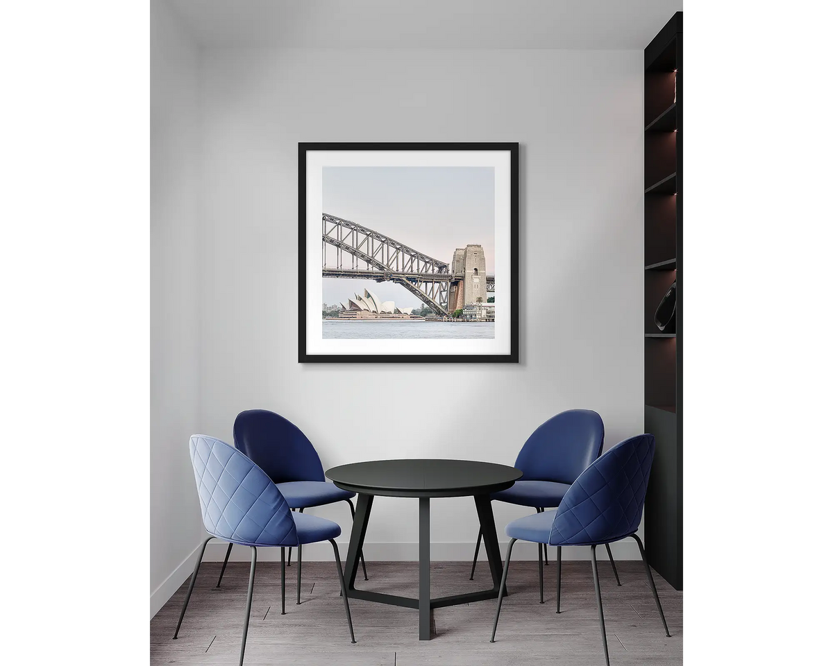 Sydney Icons. Harbour Bridge wall art print, with a black frame, in an office meeting room. 