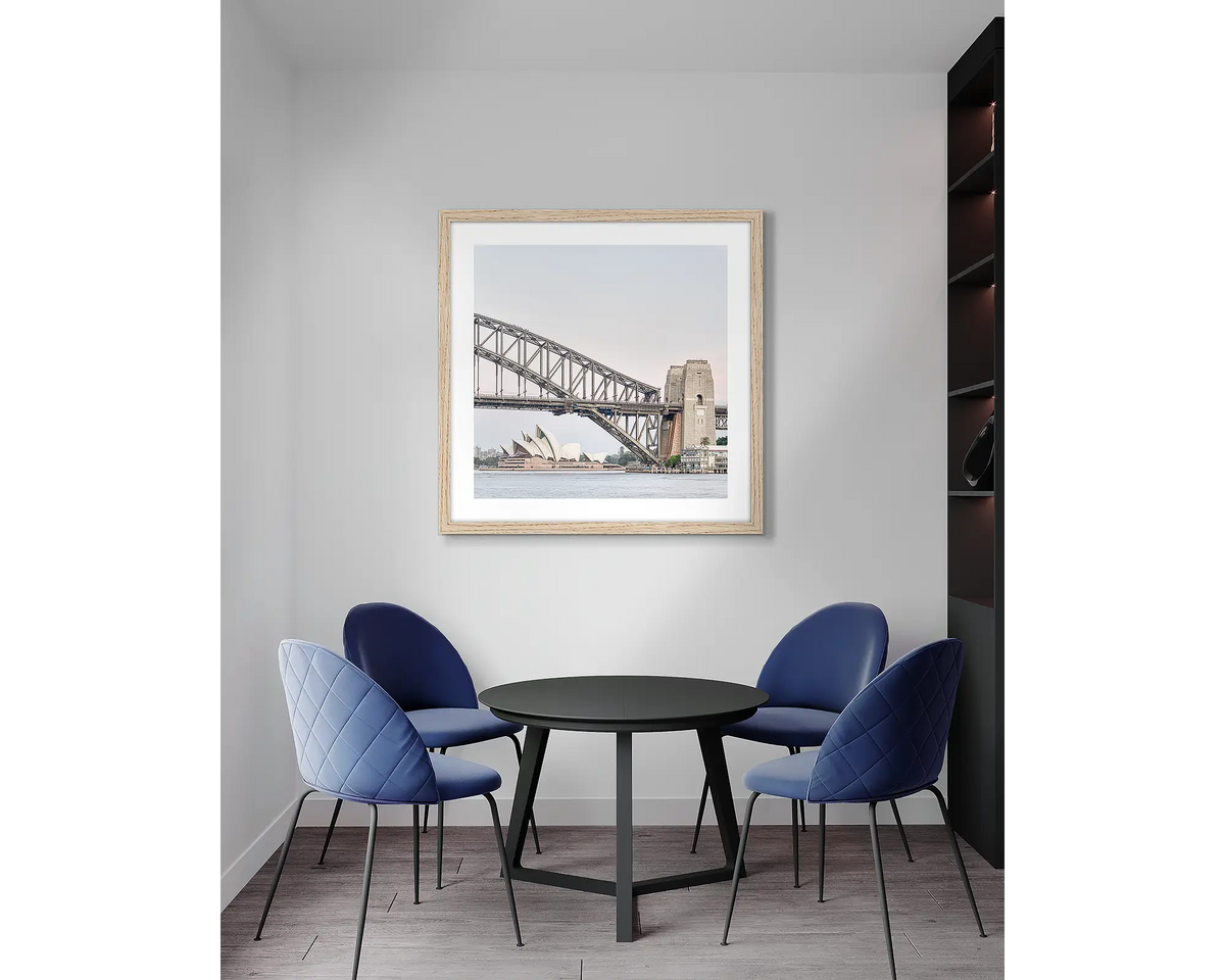 Sydney Icons. Harbour Bridge wall art print, with a timber frame, in an office meeting room. 