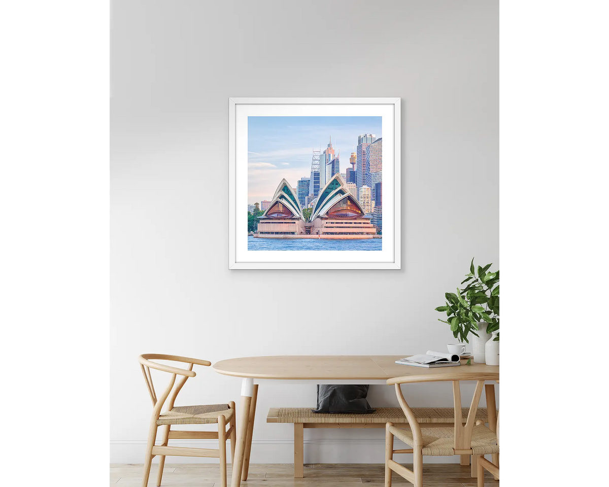 Sydney Views. Opera House artwork, with a white frame, hung above a kitchen table.