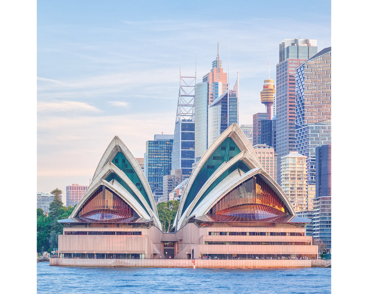 Sydney Opera House and Sydney CBD at sunset.