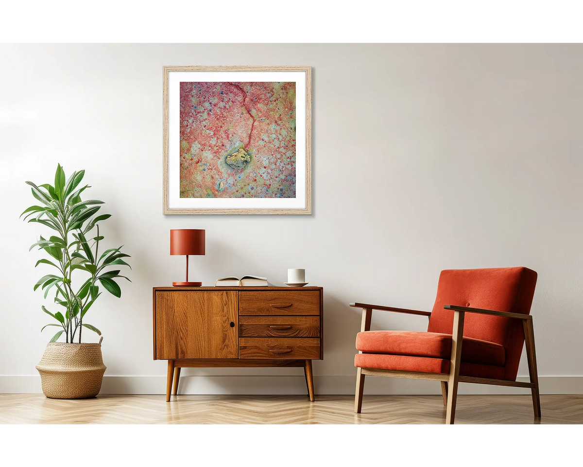 Tail End. Red sand beach, wall art print, with a timber frame, hung above a side table. 