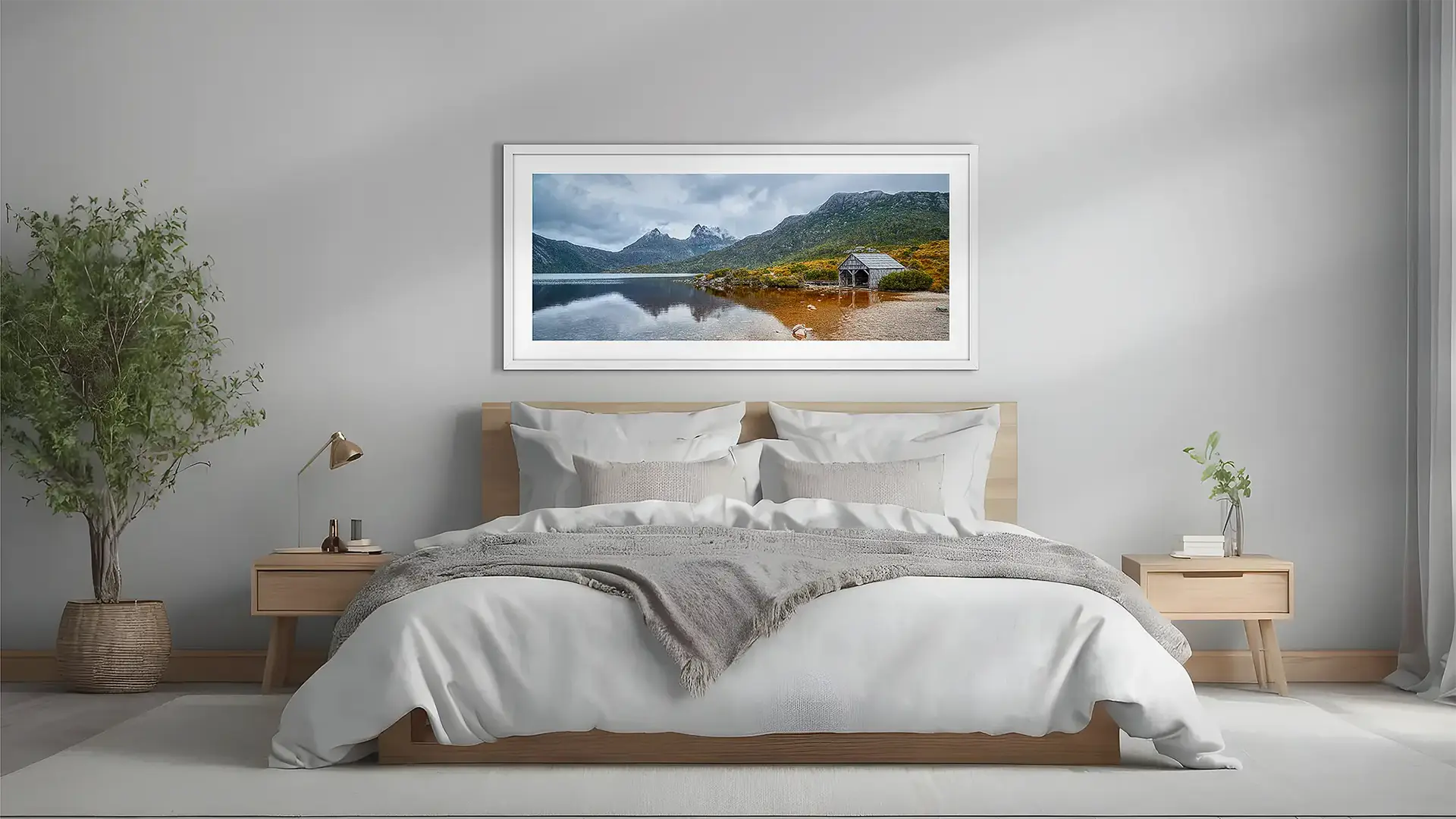 Tasmanian wall art with white frame above bed