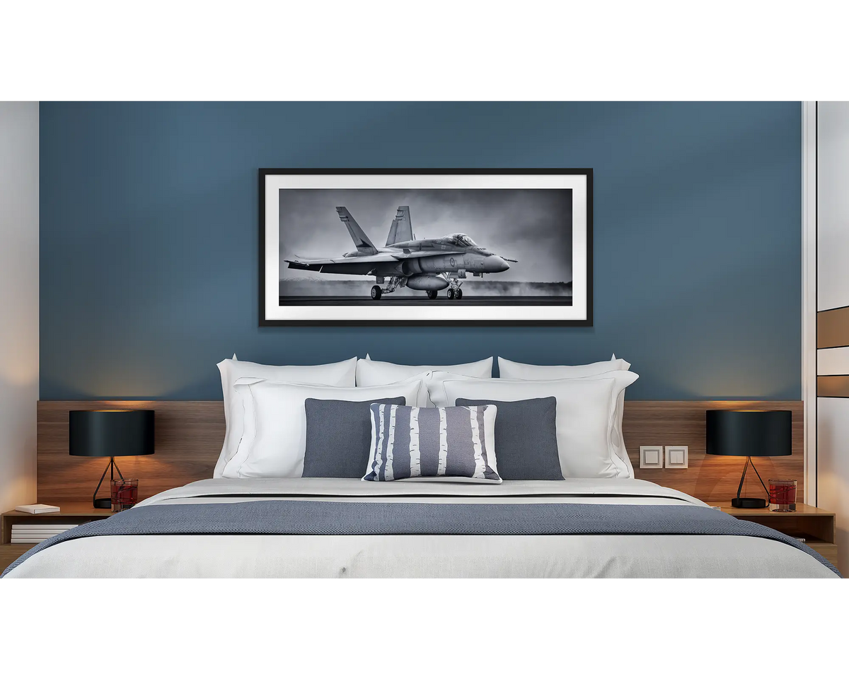 Taxiing Home. Aviation wall art in a black frame, hanging in a hotel room.