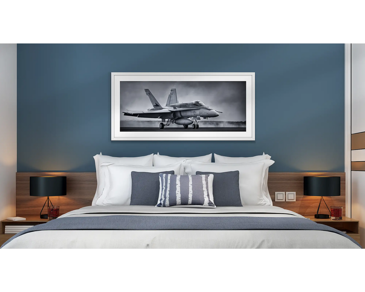 Taxiing Home. Aviation wall art in a white frame, hanging in a hotel room.