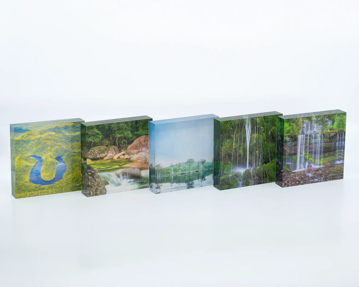 The Bend acrylic block displayed next to other acrylic blocks featuring photographs of waterways around Australia. 