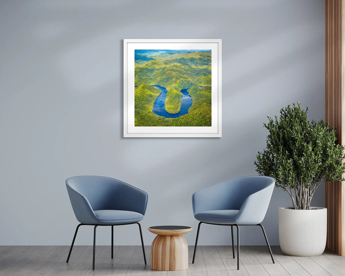 The Bend. Horseshoe Bend, Tasmanian wall art print with a white frame, in a sitting room. 