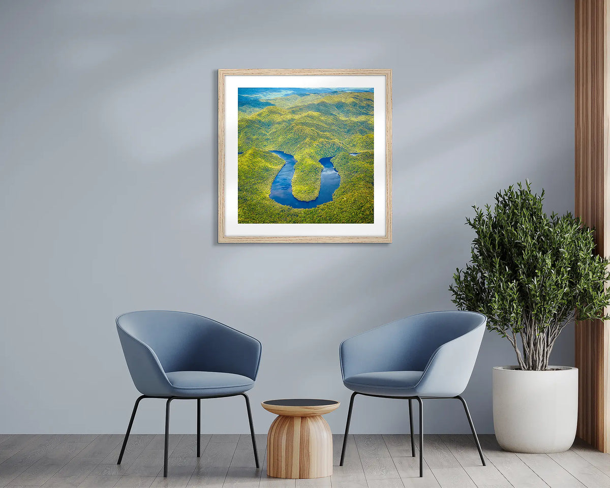 The Bend. Horseshoe Bend, Tasmanian wall art print with a timber frame, in a sitting room. 