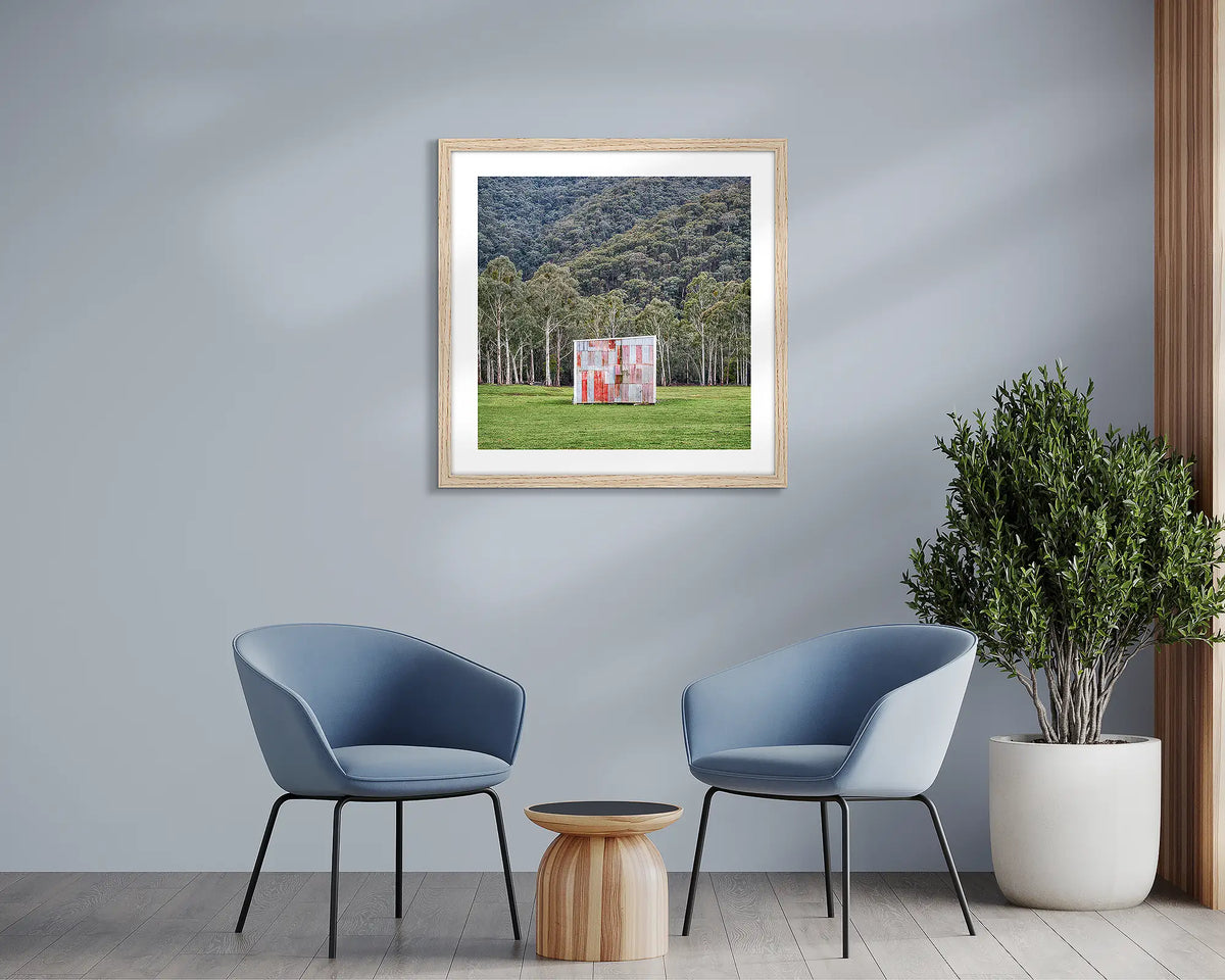 The Box. Farm shed wall art print with a timber frame, in a sitting room. 