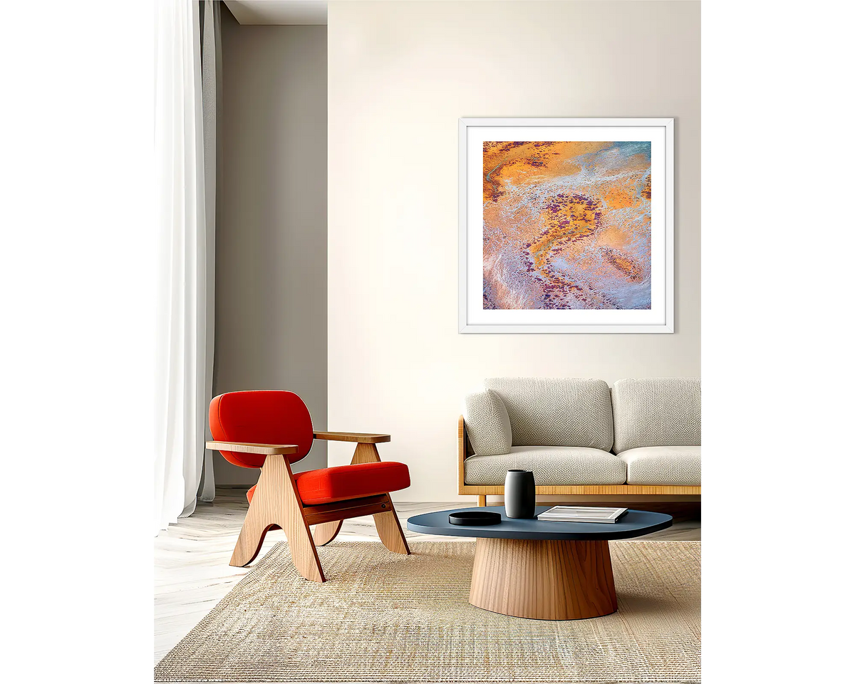 The Chase. Abstract Kimberley wall art print, with a white frame, on a lounge room wall. 