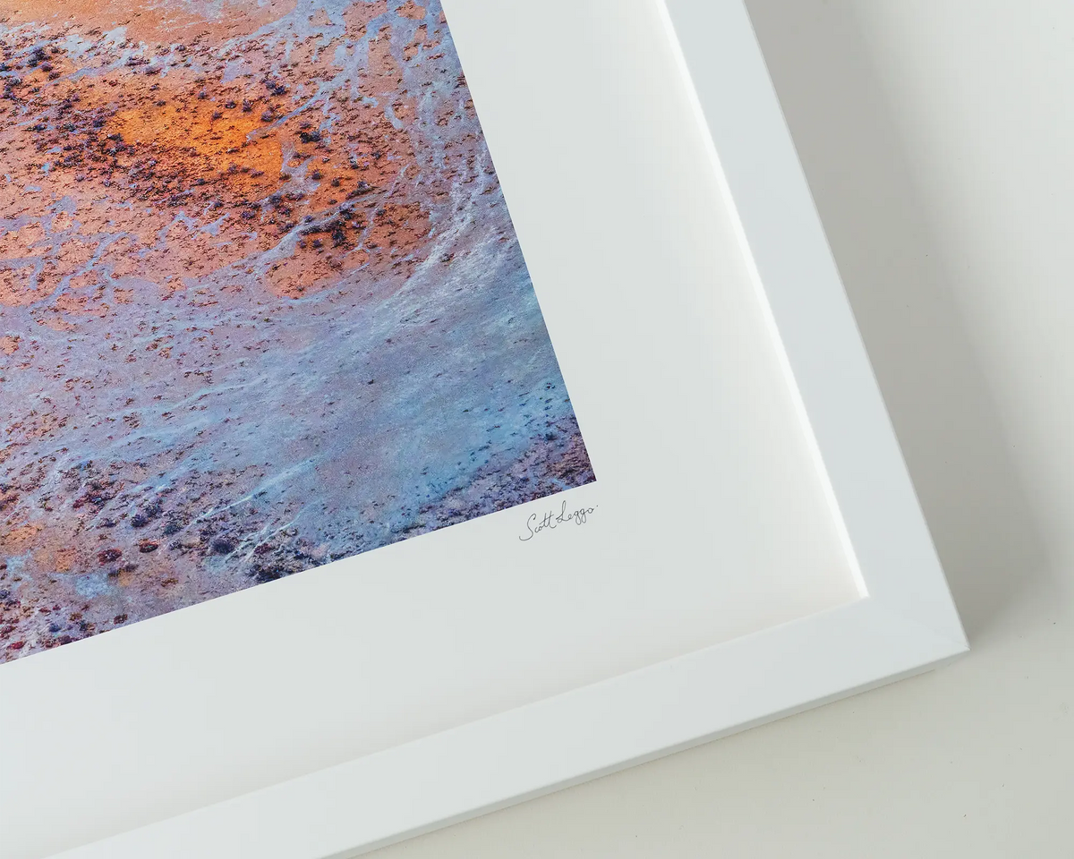 The Chase. Tidal patterns and colours of the Kimberley at Roebuck plains. Wall art in white frame.