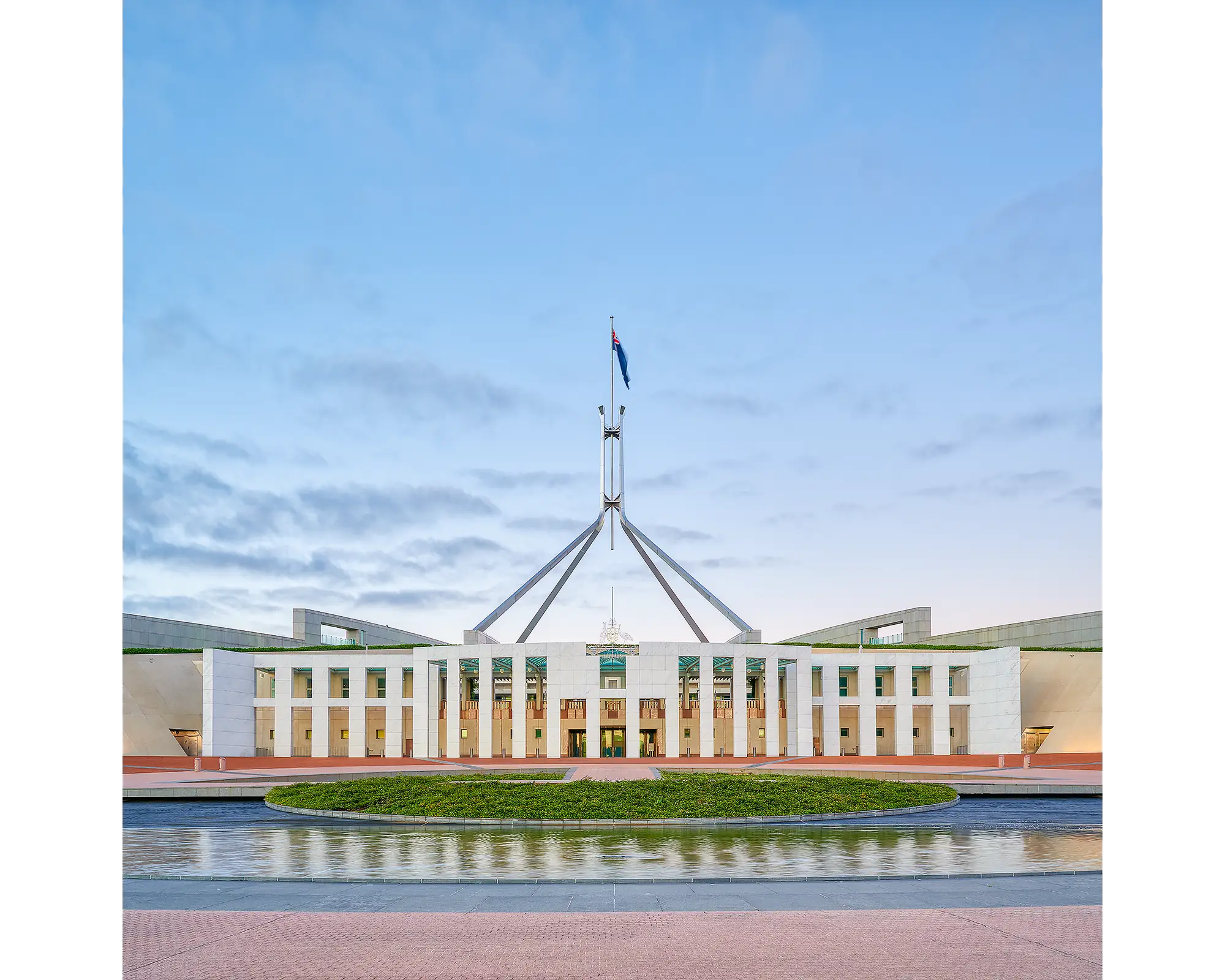 The Hill acrylic block displayed on a desk. Photograph of Australian Parliament House, Canberra, ACT. 