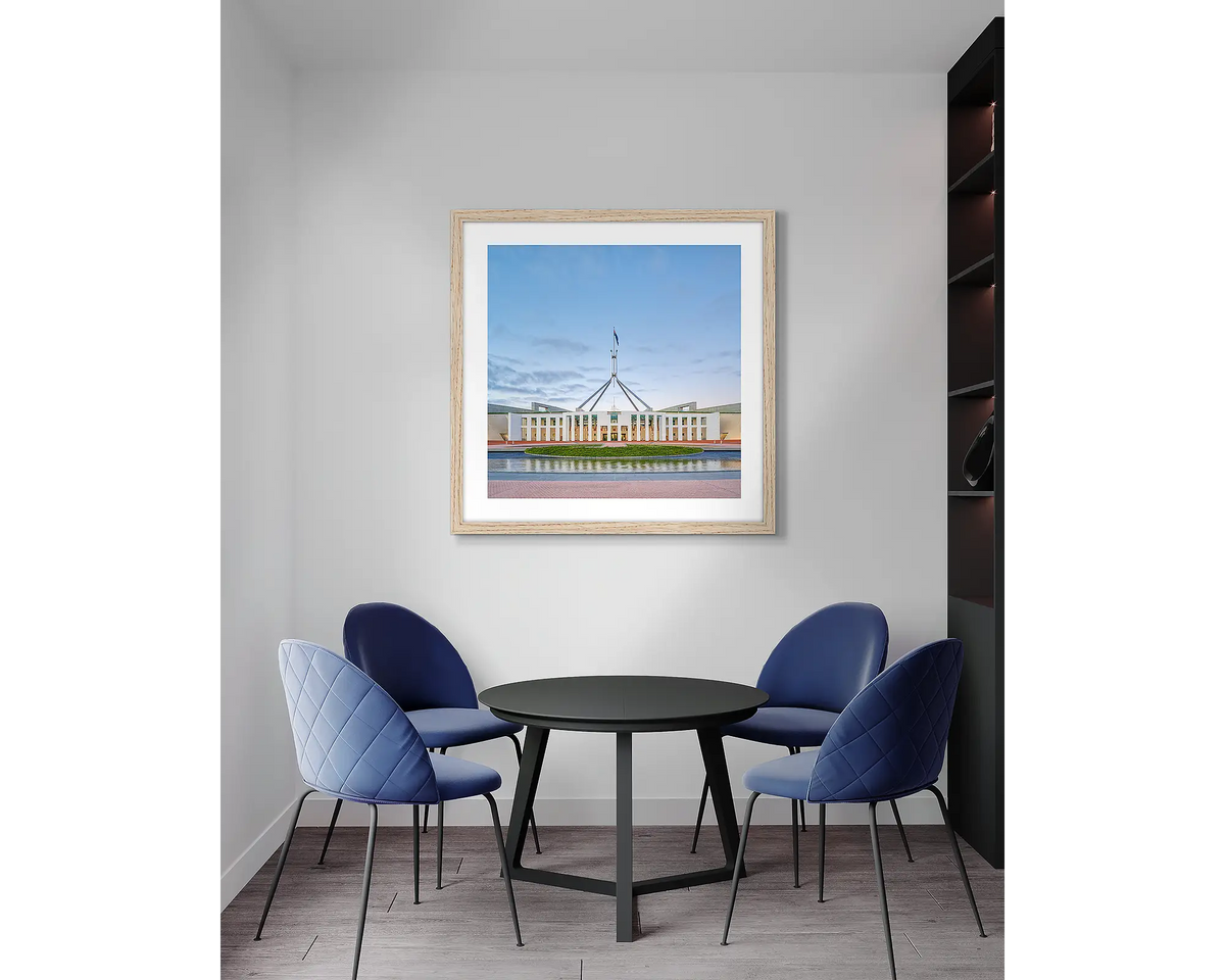 The Hill. Parliament House wall art print with a timber frame, in an office meeting room. 