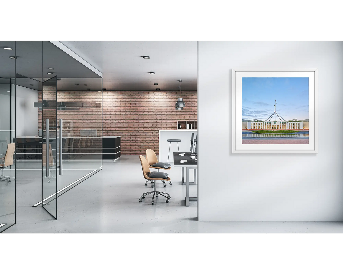 The Hill. Parliament House wall art print with a white frame, on a modern office wall. 