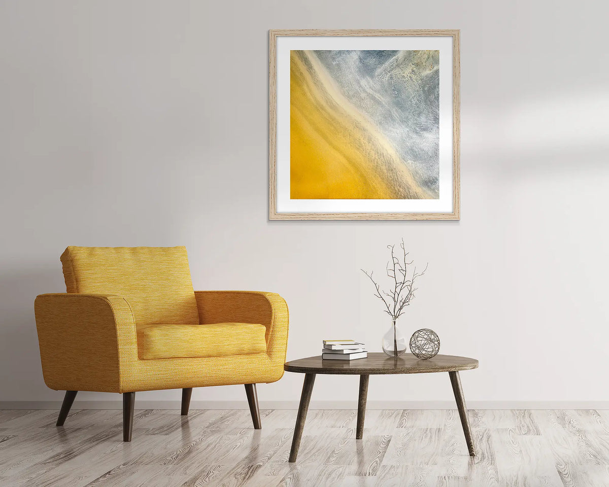 The Line. Aerial abstract artwork with timber frame hung above lounge chair.