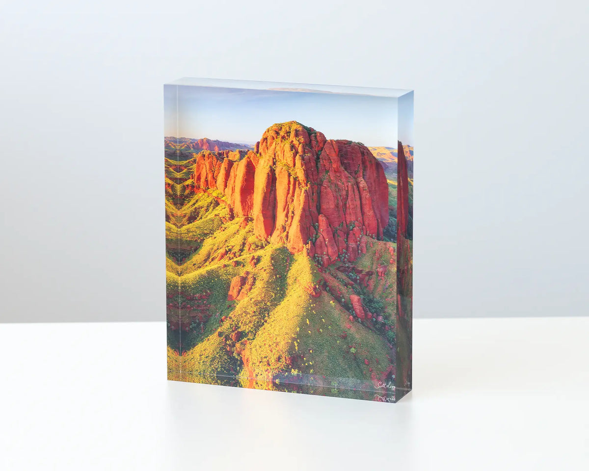 The Rock acrylic block displayed on a desk - photograph of cliffs in the Kimberley, WA.