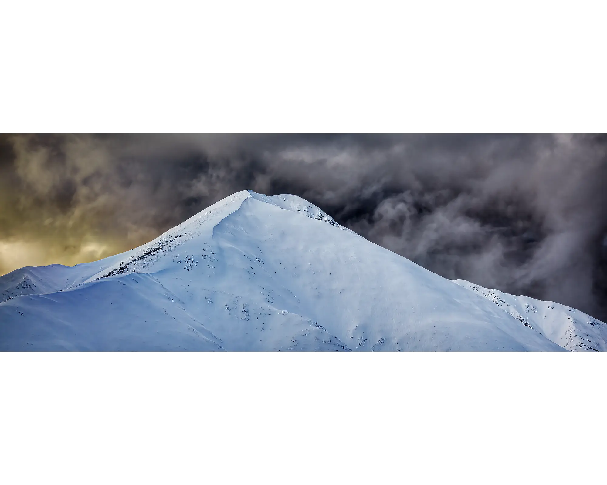 Dark storm clouds over the summit of Mount Feathertop, Alpine National Park, Victoria. 