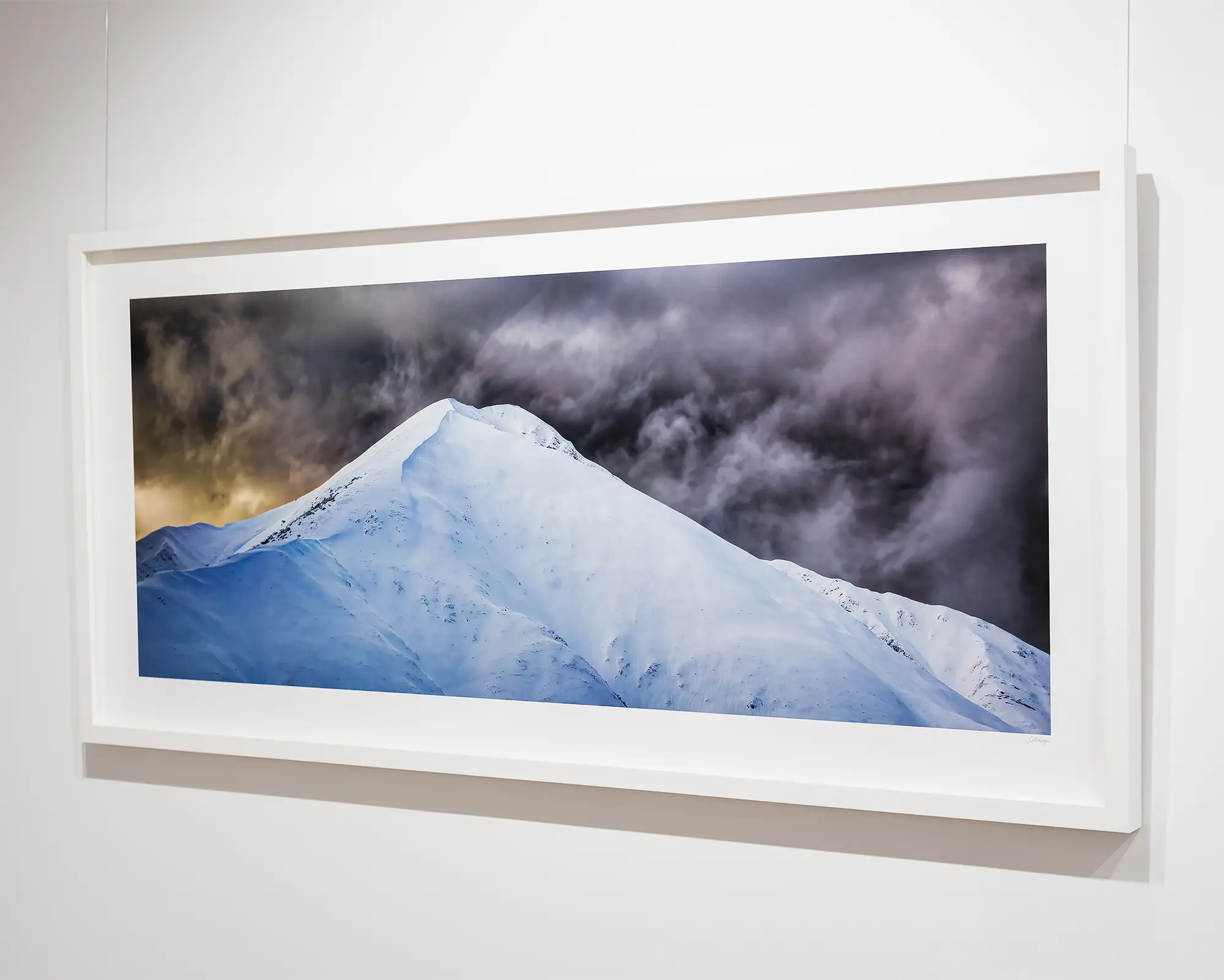 The Summit. Mount Feathertop with snow and dark clouds, Alpine National Park, Victoria, Australia.