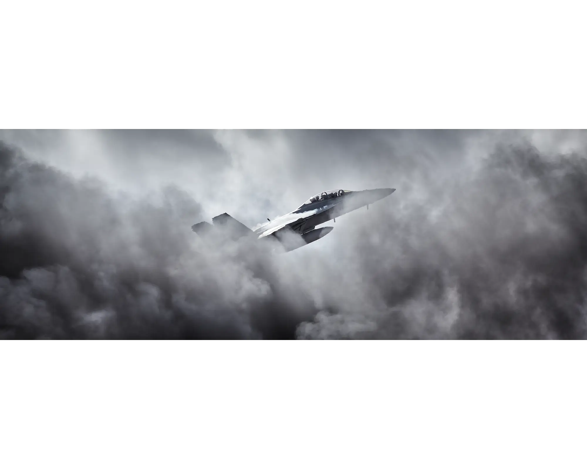 Royal Australian Air Force F/A-18 Super Hornet flying through clouds. 