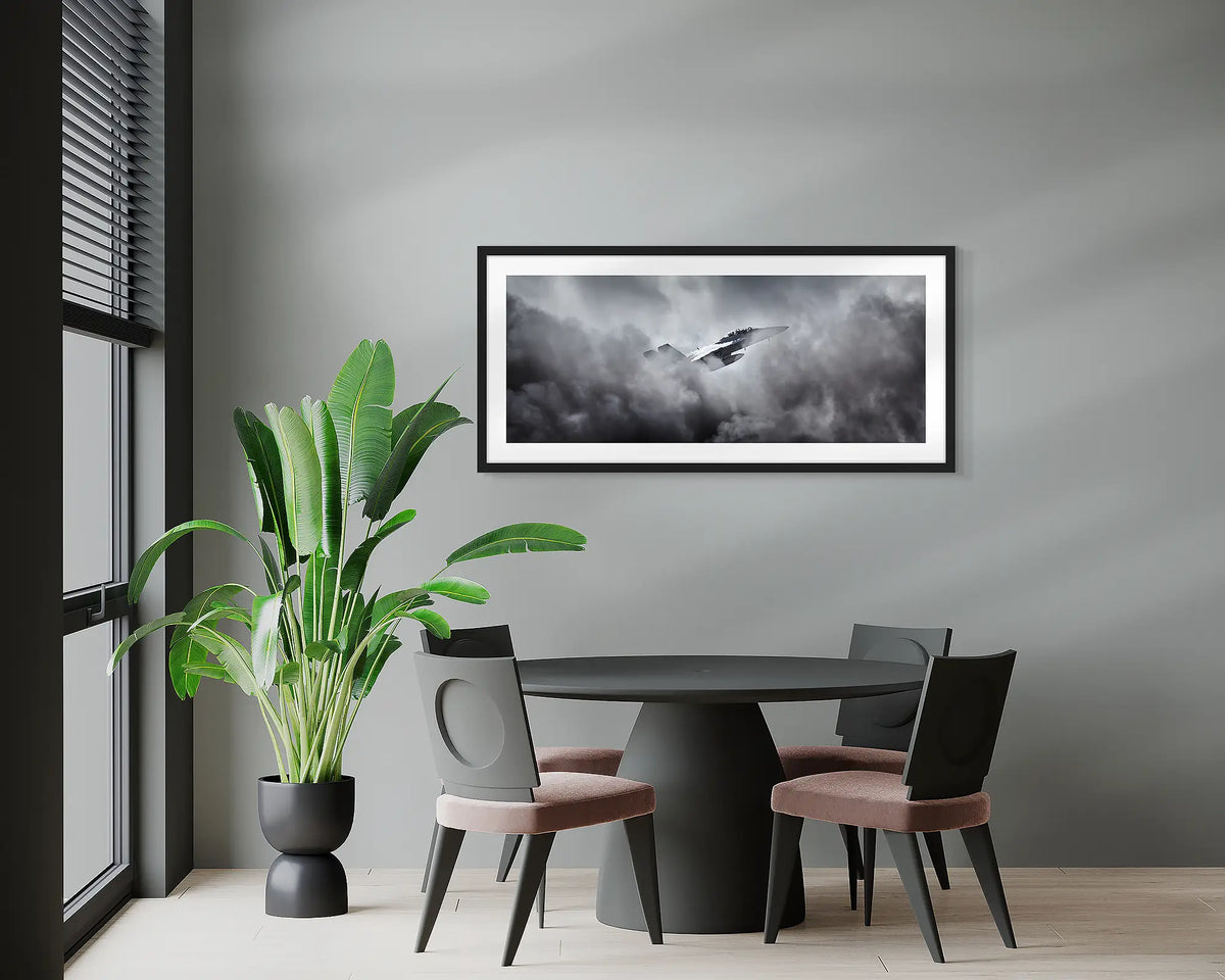 Through the Fire. F-18 Hornet, wall art print, with a black frame, hung above a meeting room table.