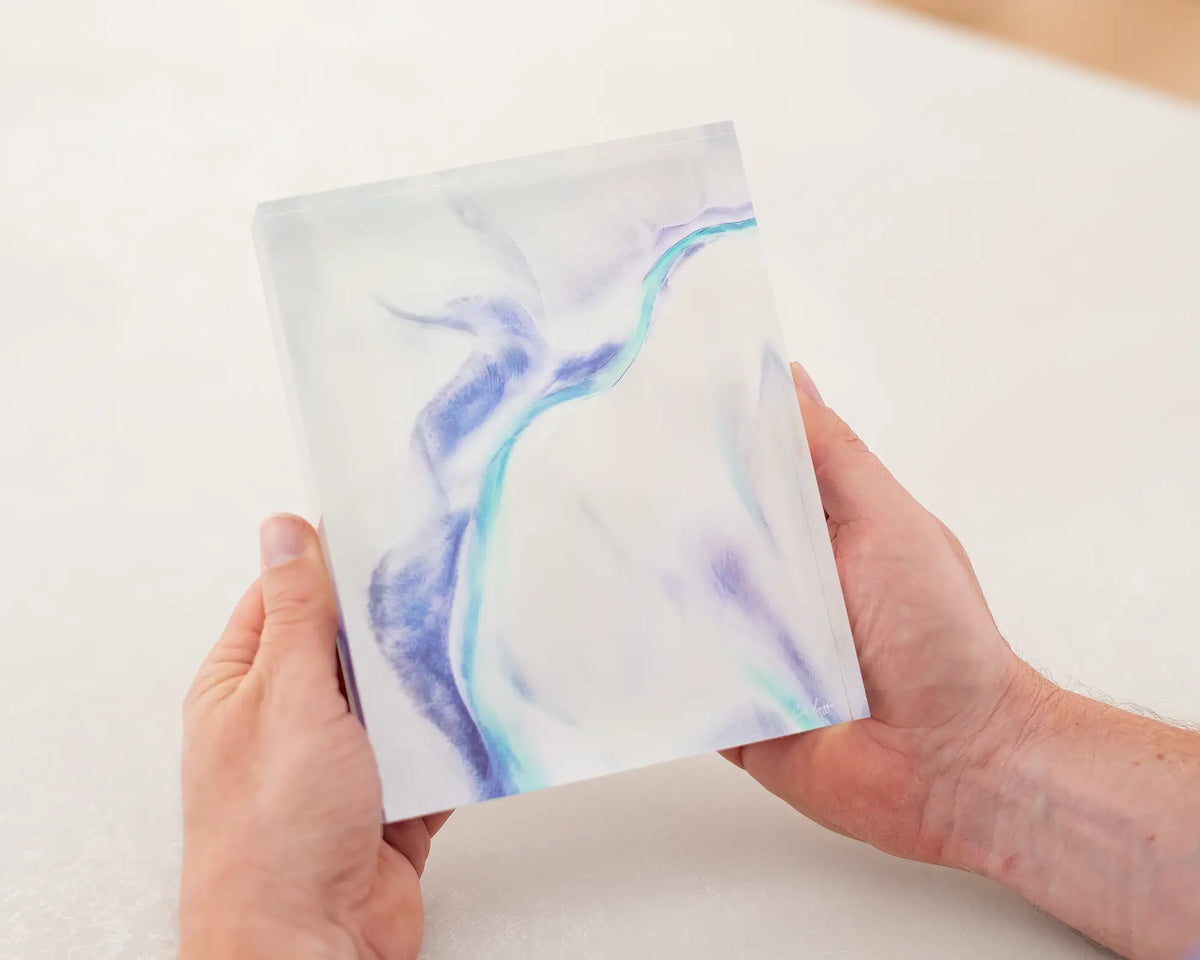 Tidal Orchid coastal acrylic block being held in hands. 