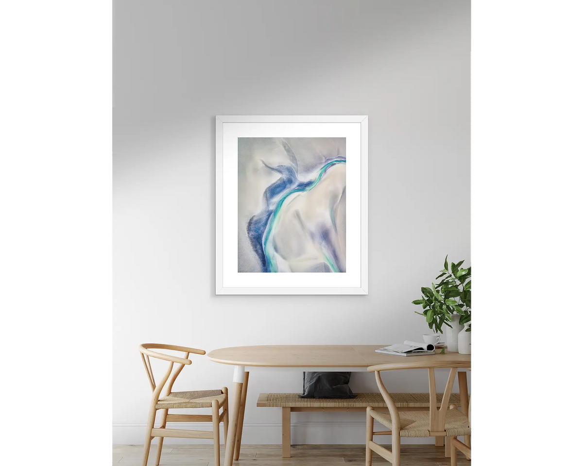 Tidal Orchid. Abstract artwork with a white frame, hanging above a table. 