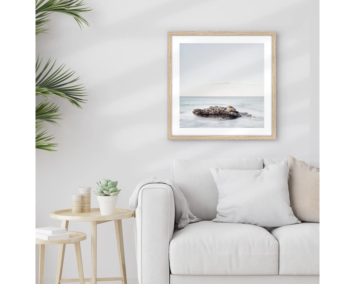 Time. Sunshine Coast wall art print, with a timber frame, hung above a couch.