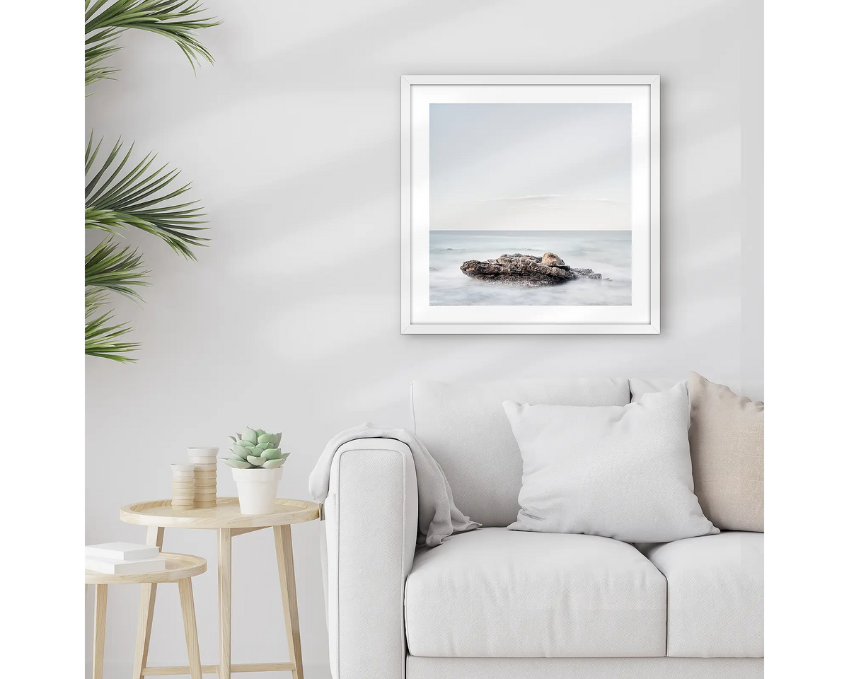 Time. Sunshine Coast wall art print, with a white frame, hung above a couch.