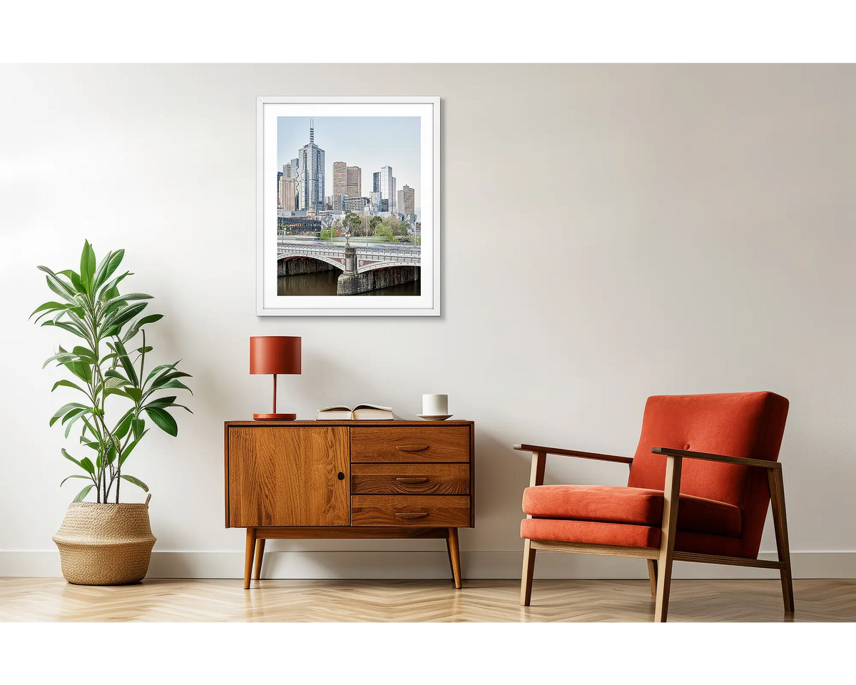 Top End. Melbourne CBD artwork, in a white frame, above a side table. 