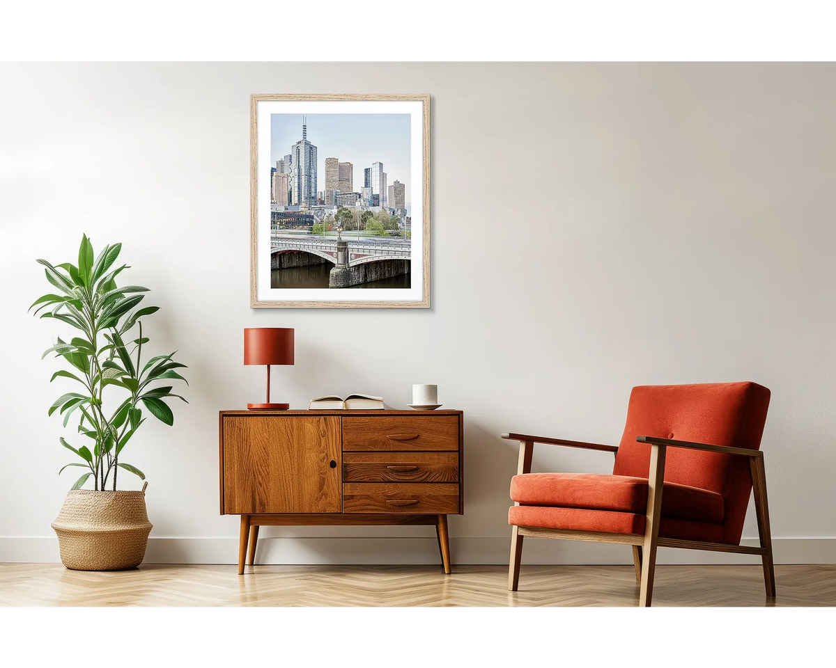 Top End. Melbourne CBD artwork, in a wood frame, above a side table. 