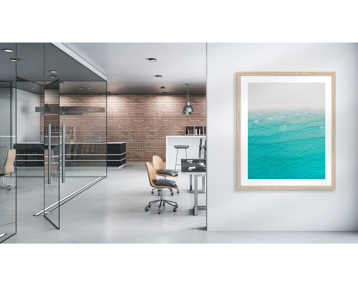 Tranquility. Whitehaven beach wall art print, with a timber frame, in a modern office. 