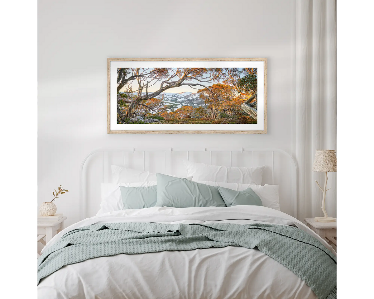 Twynam&#39;s View. Framed Snowy Mountains wall art, hanging above a bed.