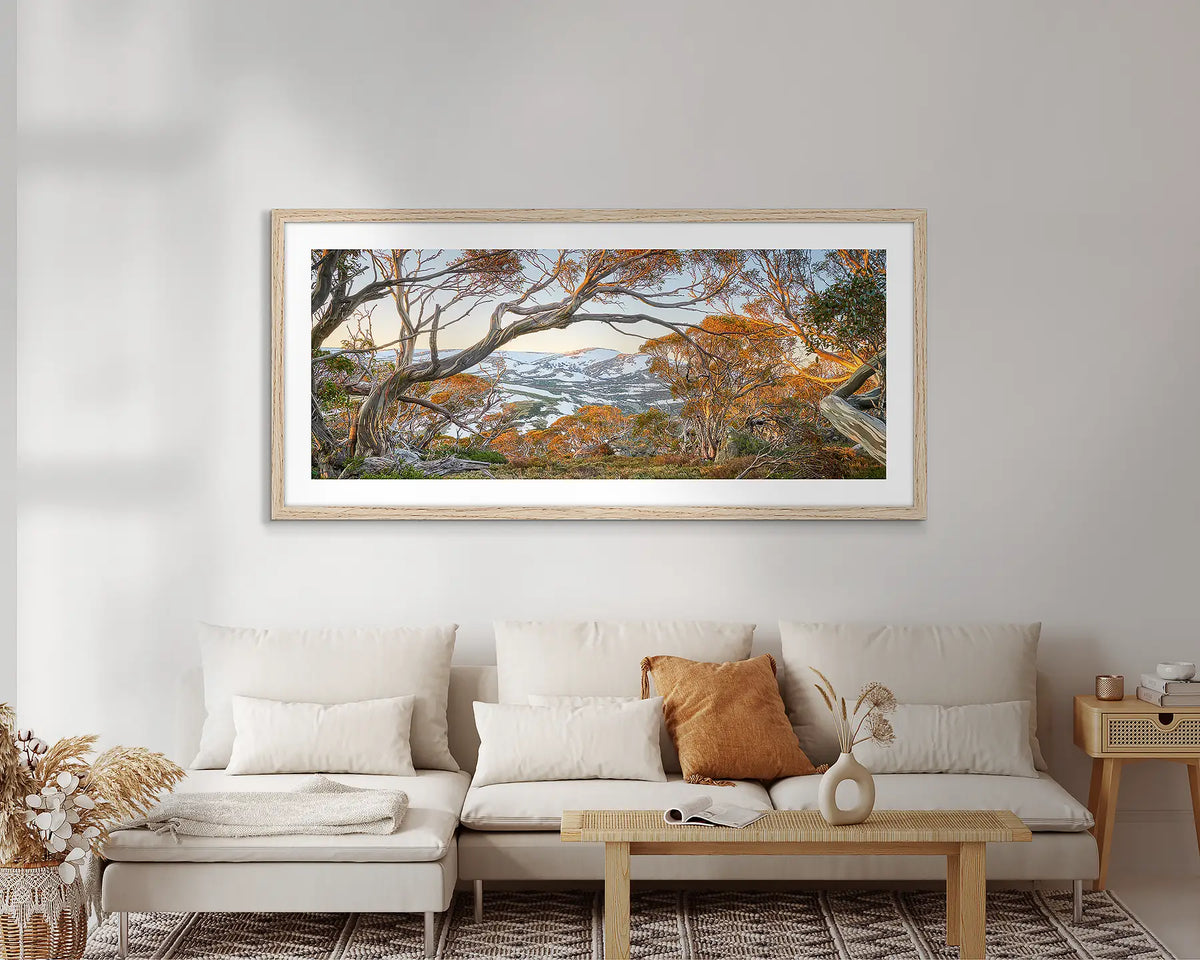 Twynam&#39;s View. Framed Snowy Mountains wall art, hanging above a couch. 