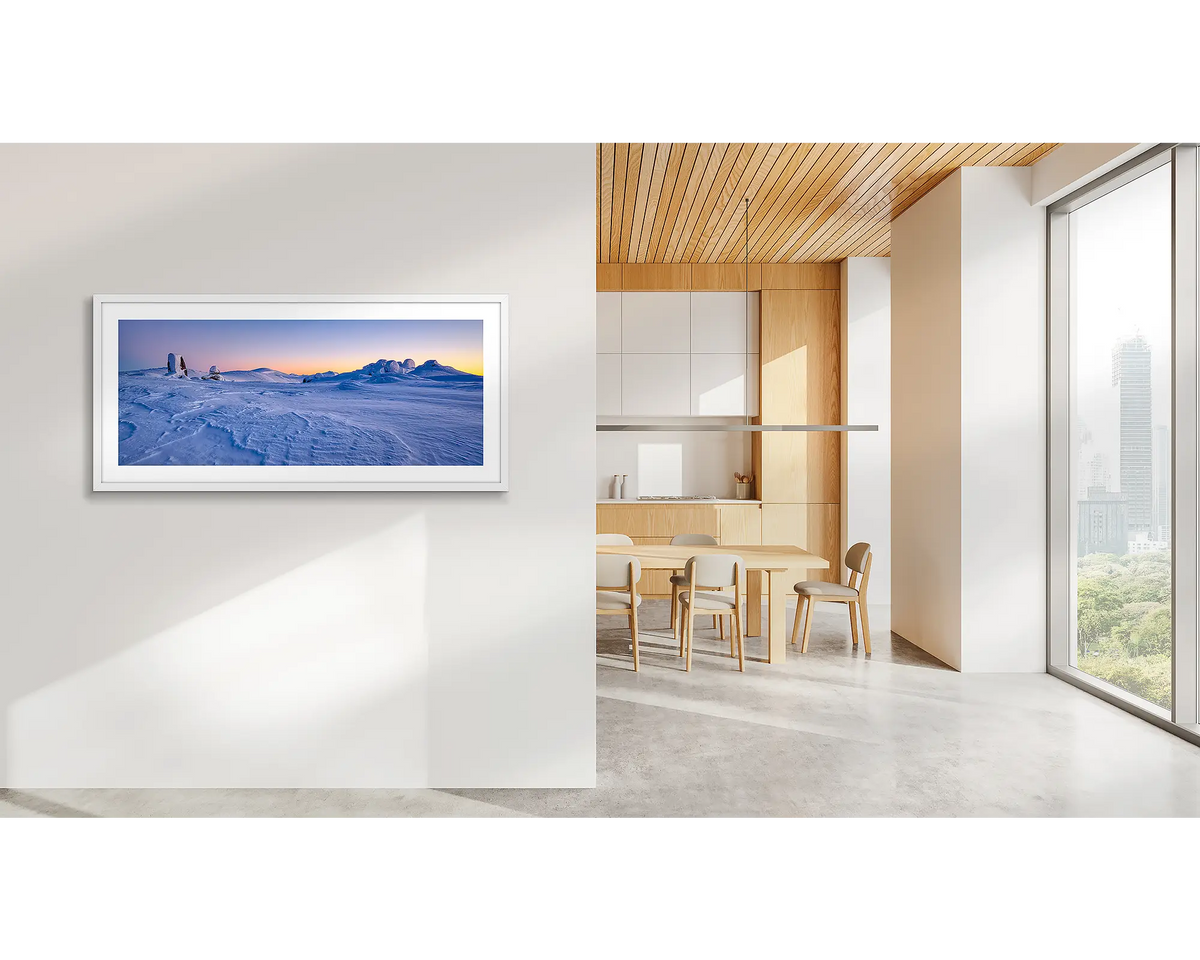 View to Kosciuszko. Snowy Mountains artwork, with a white frame, in a CBD office. 