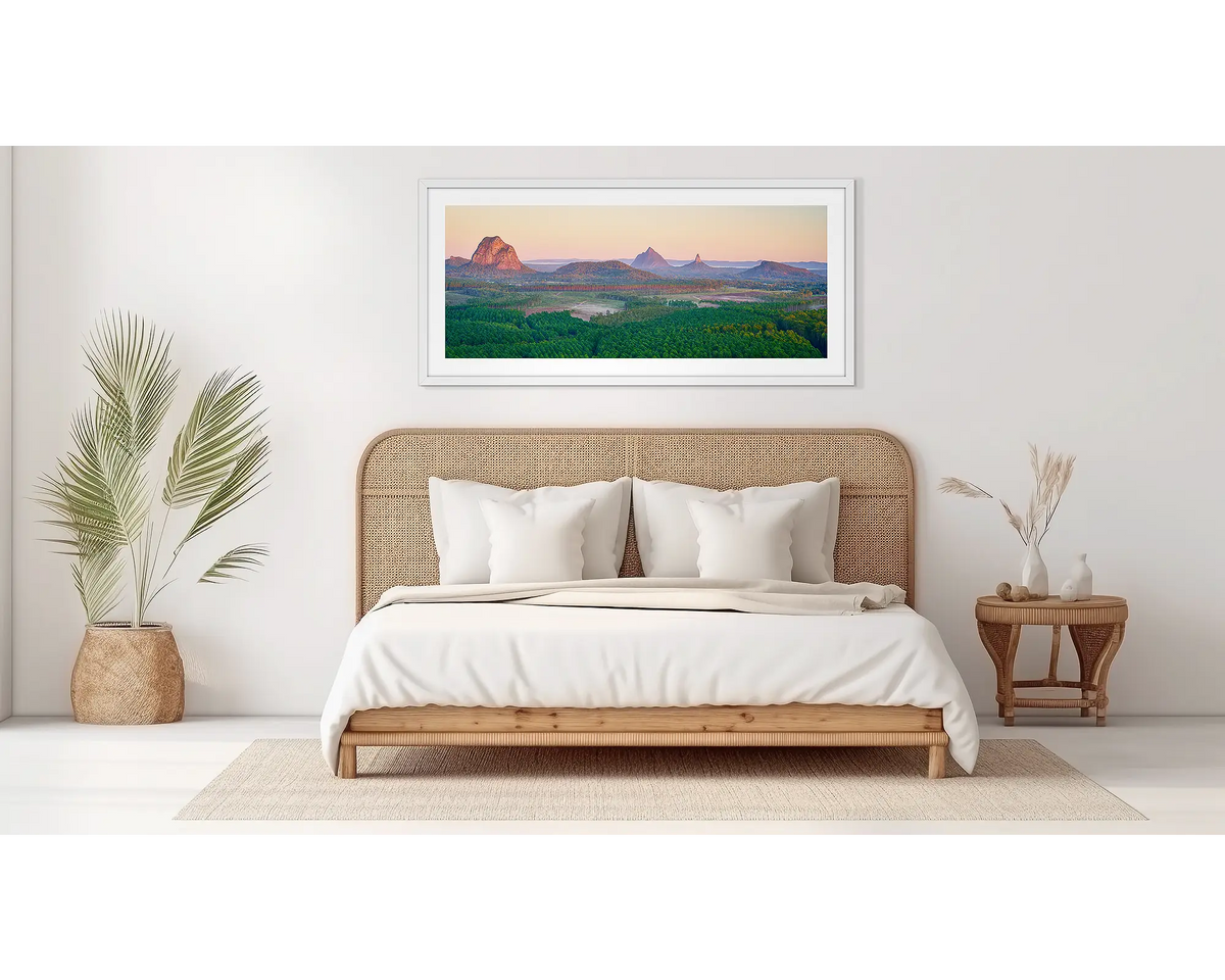 Volcanic Dawn. Glass house Mountains in a white frame, in a bedroom. 