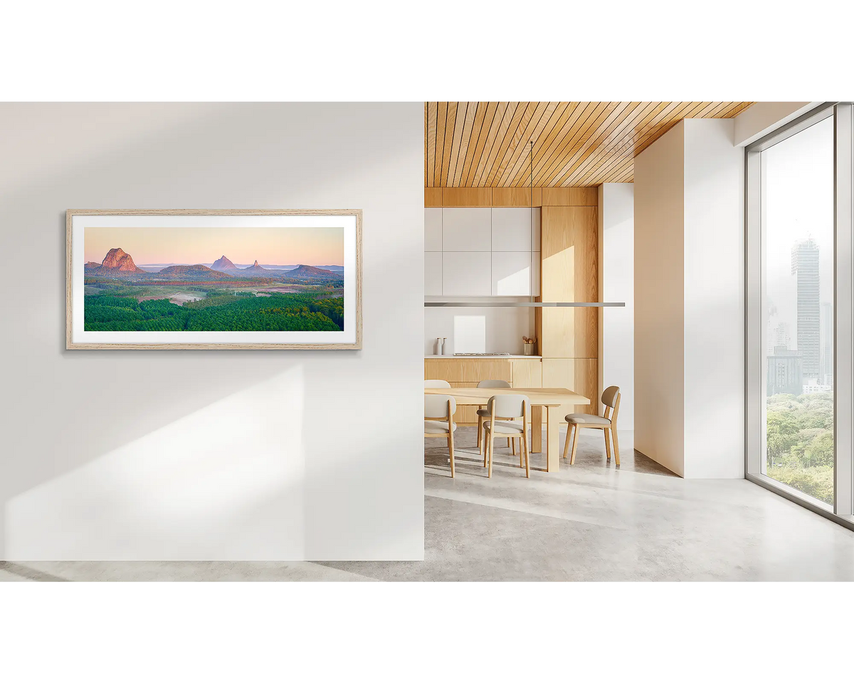 Volcanic Dawn. Glass House Mountains artwork, with a timber frame, in a CBD office. 