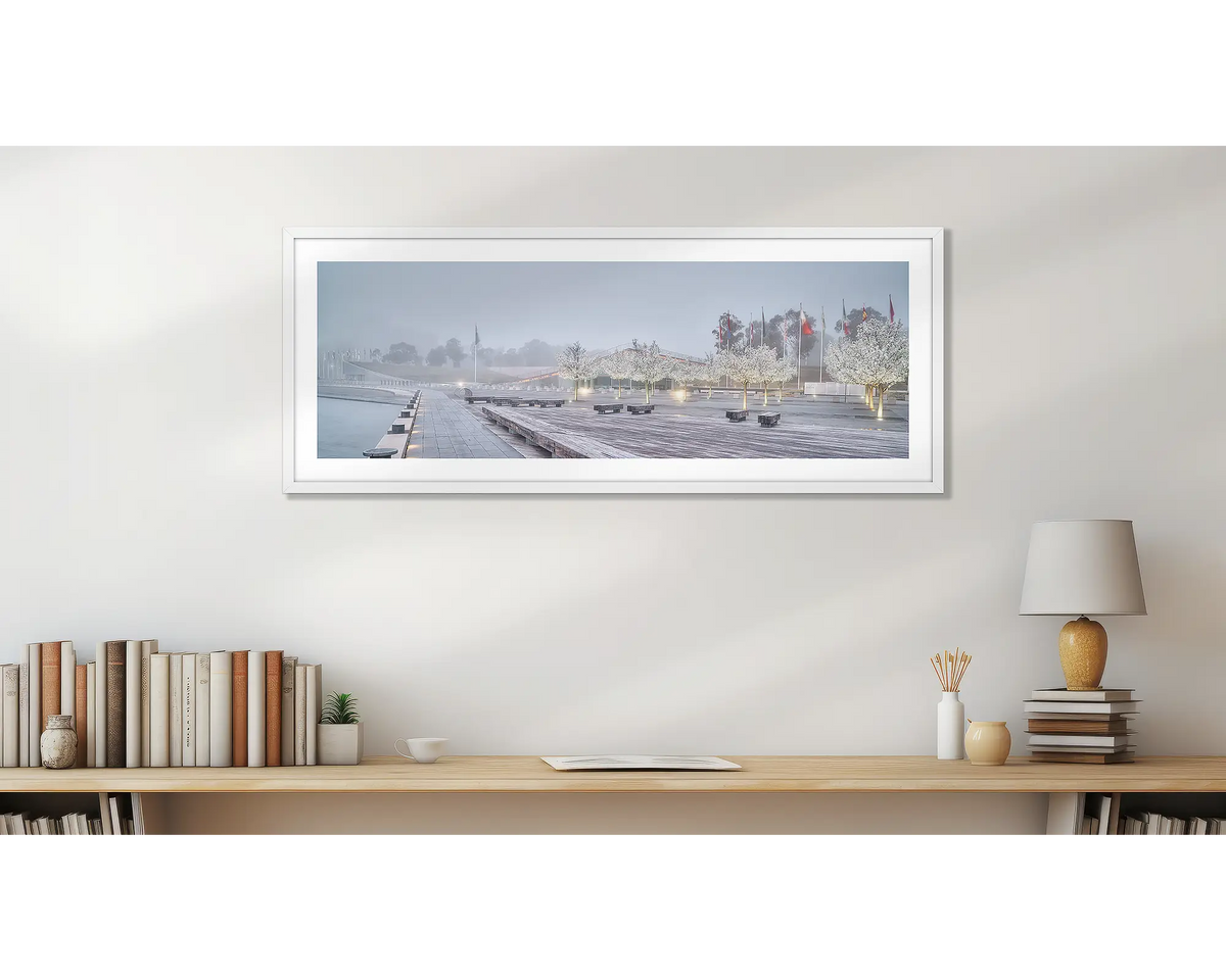 Waters Edge. White framed Canberra wall art above study desk.