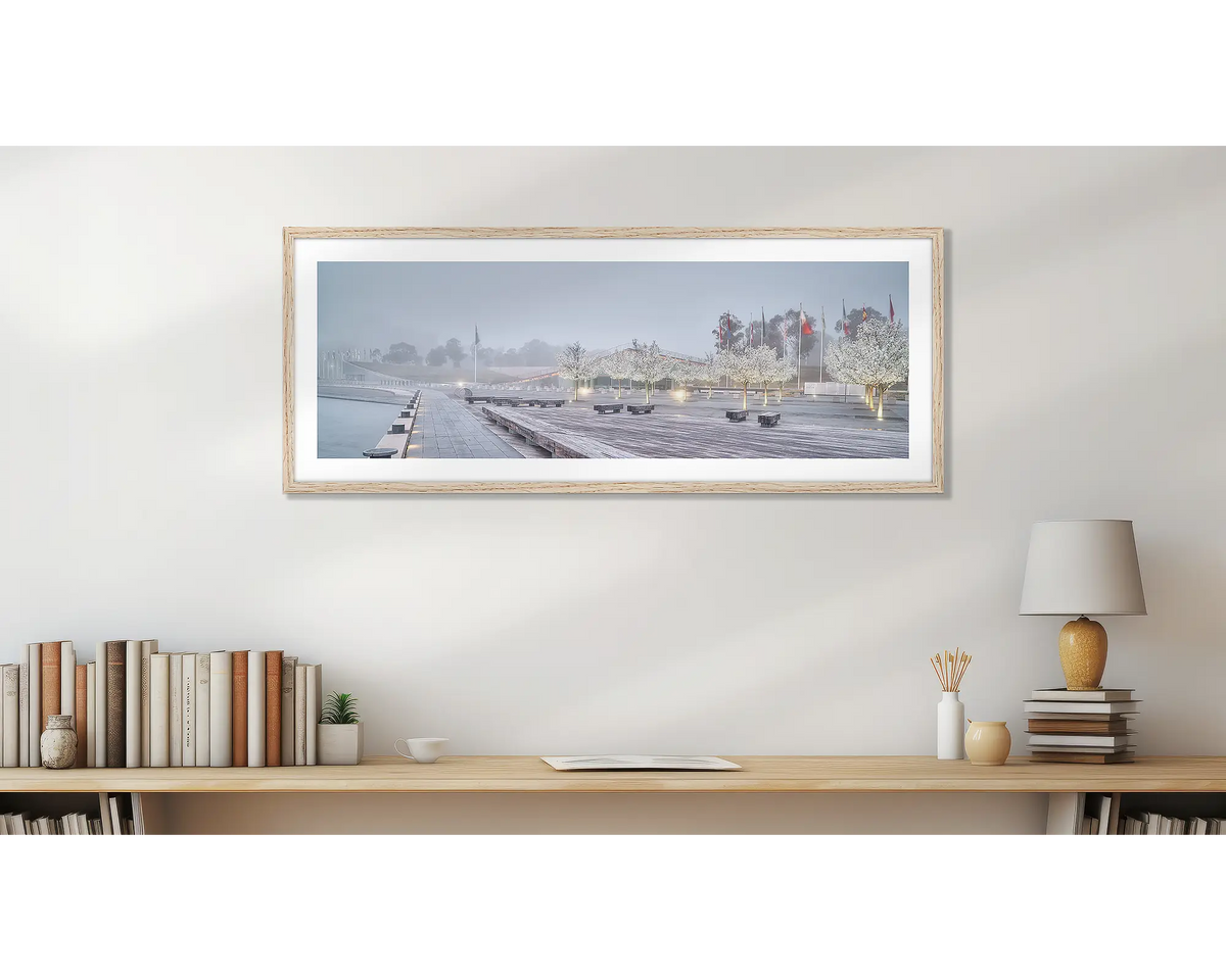 Waters Edge. Wood framed Canberra wall art above a study desk.