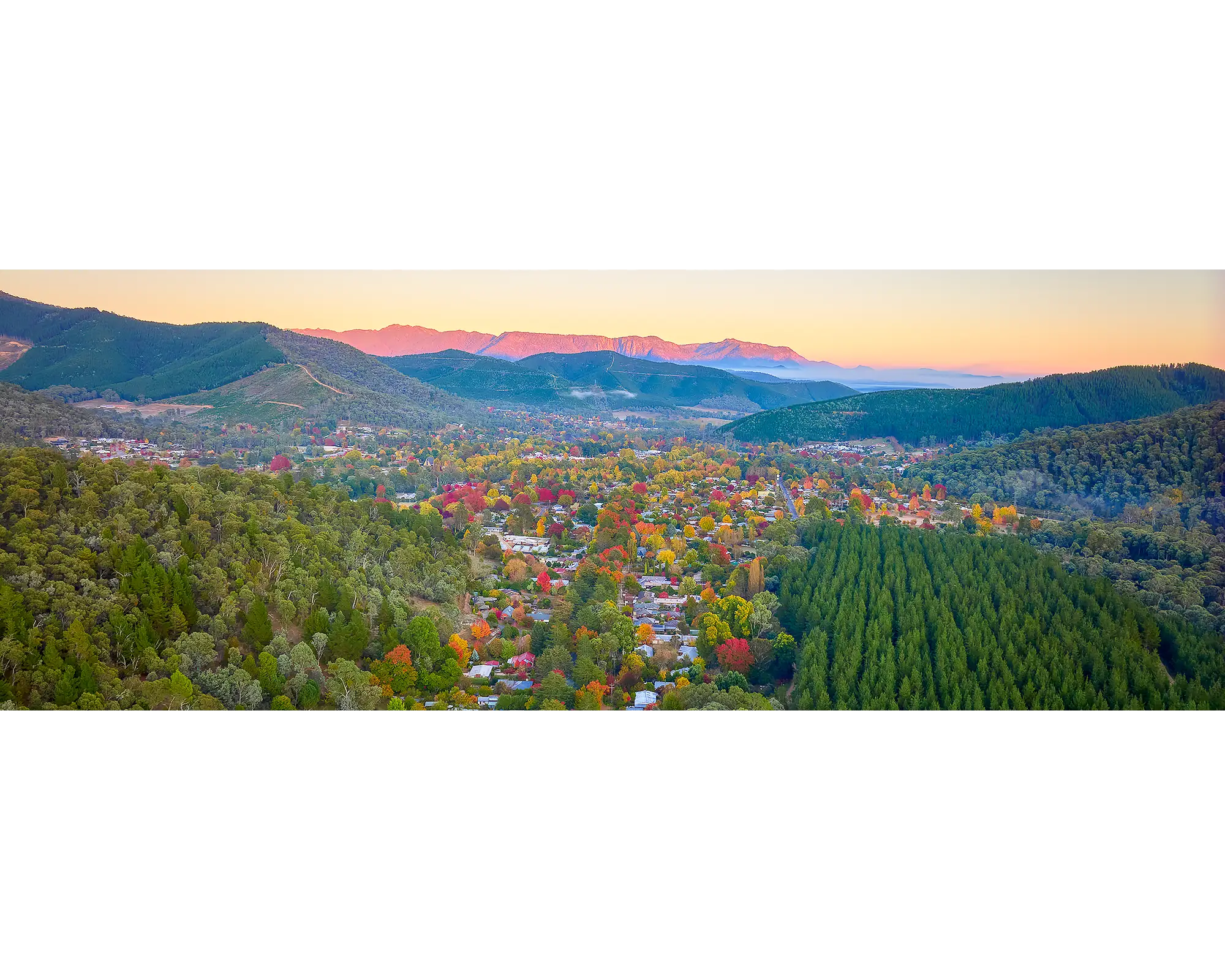 Welcome to Bright. Autumn sunrise over the town of Bright, Victoria.