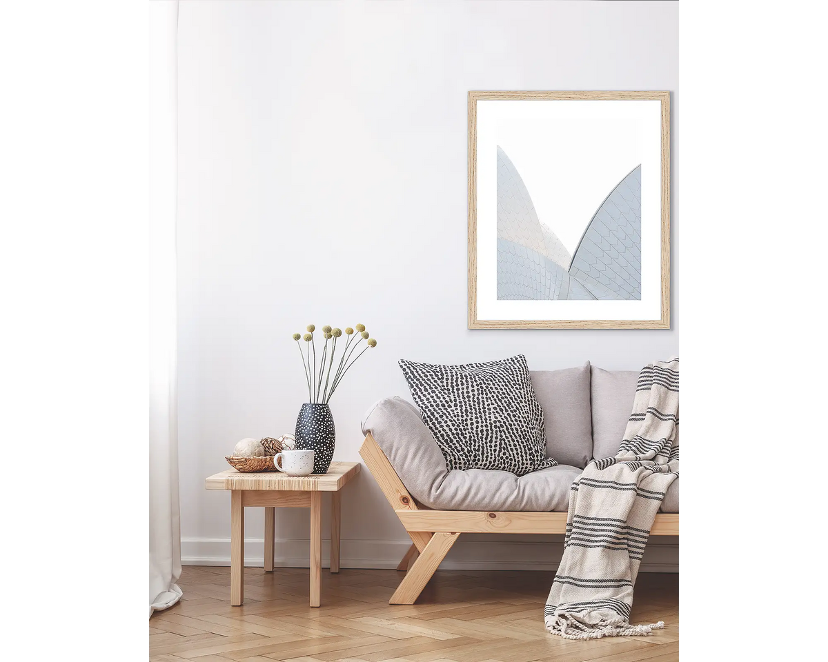 White On White. Sydney wall art print in Tasmanian Oak frame, hanging above a couch.