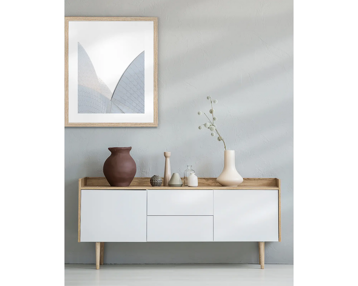 White On White framed Sydney wall art with Tasmanian Oak frame above side table.