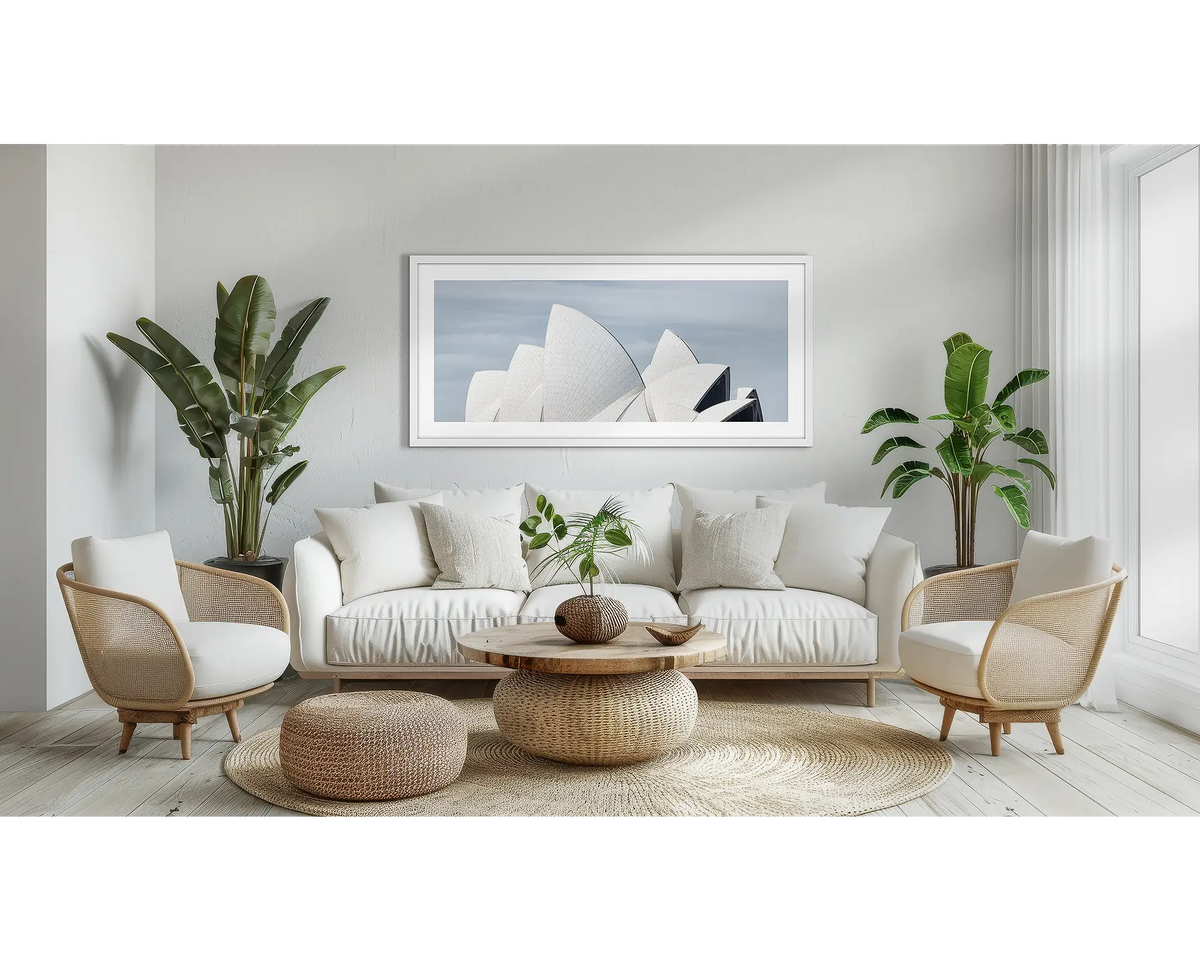 White Salis. Sydney Opera House wall art in a white frame, hanging in a lounge room.