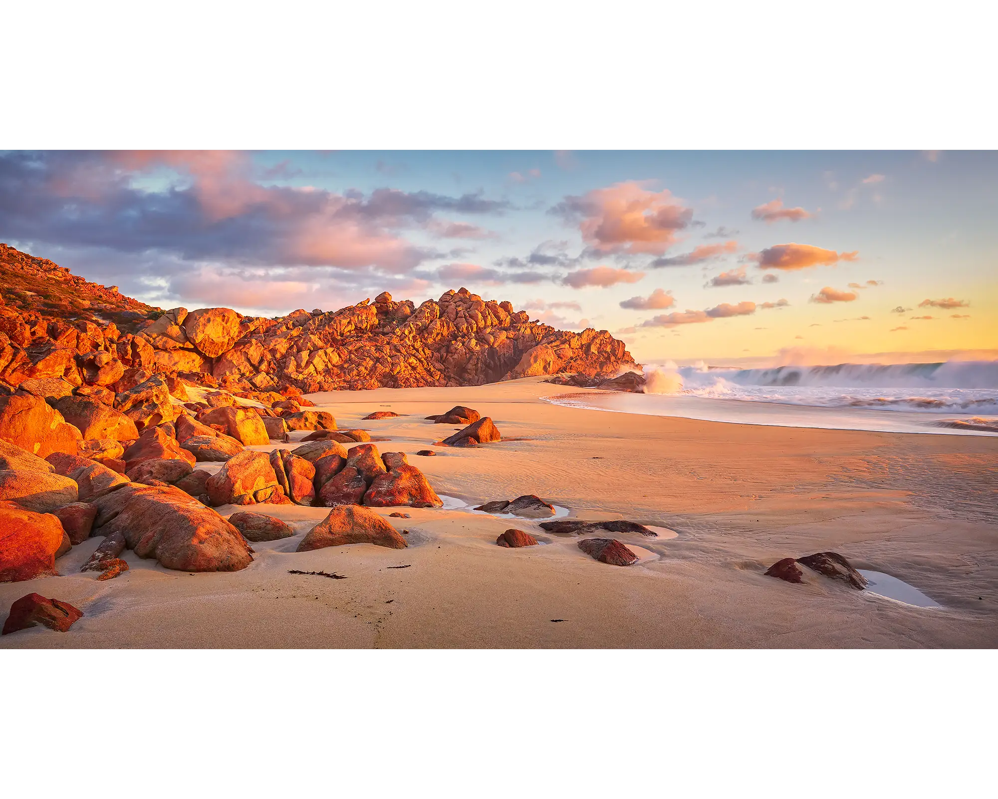 Waves rolling in at Wyadup Beach, bathed in sunset light, WA.